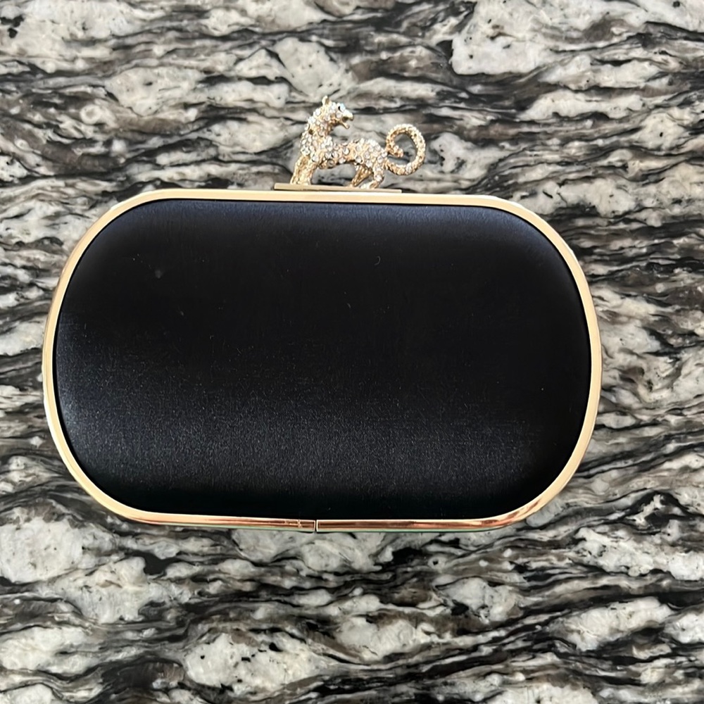 Black formal clutch with cheetah clasp